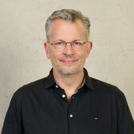 A simple, gray user icon on a light gray background, featuring a circle for a head and a rounded rectangle for the shoulders and body, often used as a placeholder for profile pictures at Hochschule Coburg.